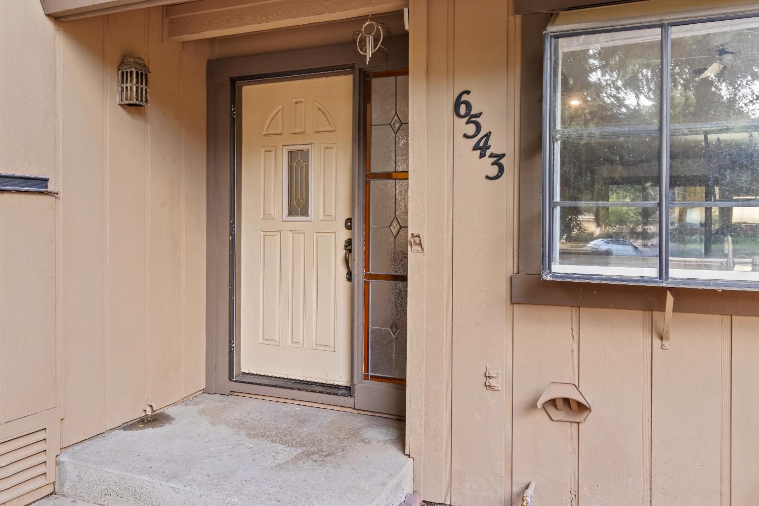 6543 Crosswoods Circle Citrus Heights, CA 95621 - Photo 7 of 33 a view of a glass door with a glass door