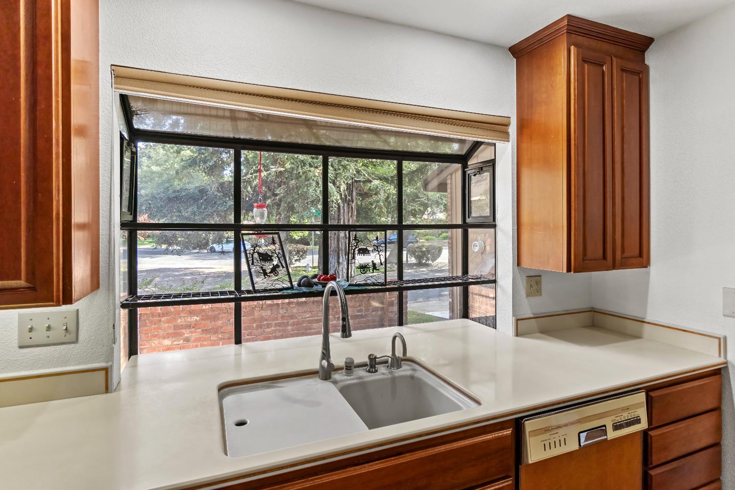 6543 Crosswoods Circle Citrus Heights, CA 95621 - Photo 10 of 33 a kitchen with a sink and a large window