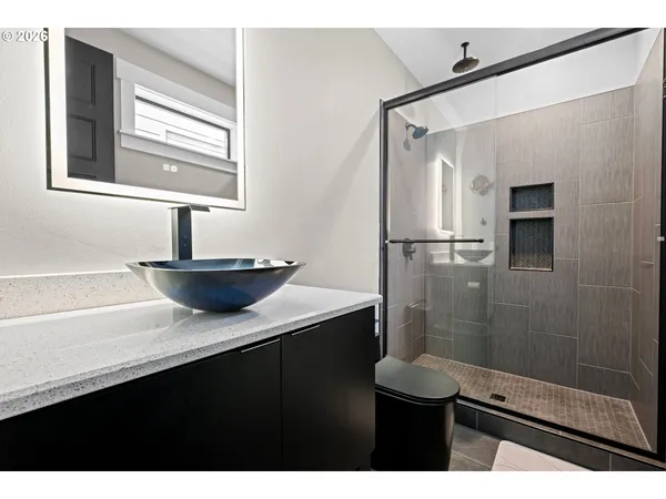 a kitchen with a sink cabinets and appliances