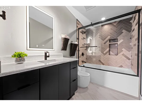 a living room with furniture window and wooden floor