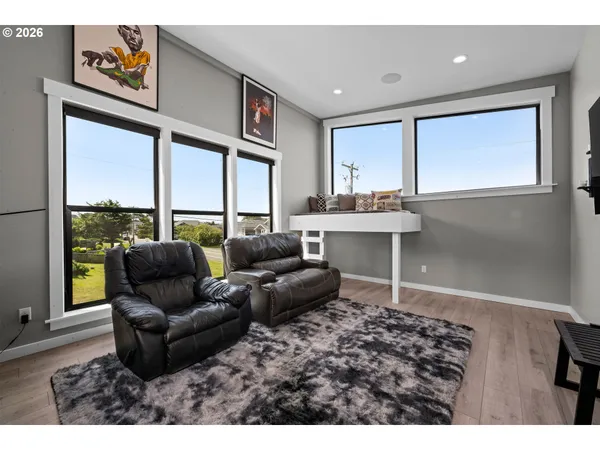 a spacious bedroom with a bed and a large window