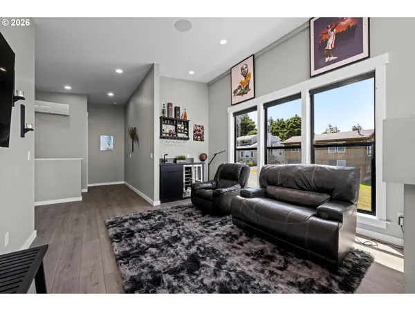 a bedroom with a bed and a ceiling fan