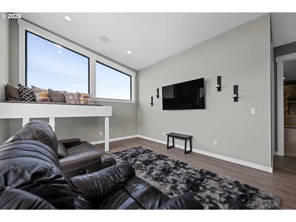 a view of living room with furniture and a potted plant