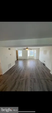 a bathroom with a sink toilet and mirror
