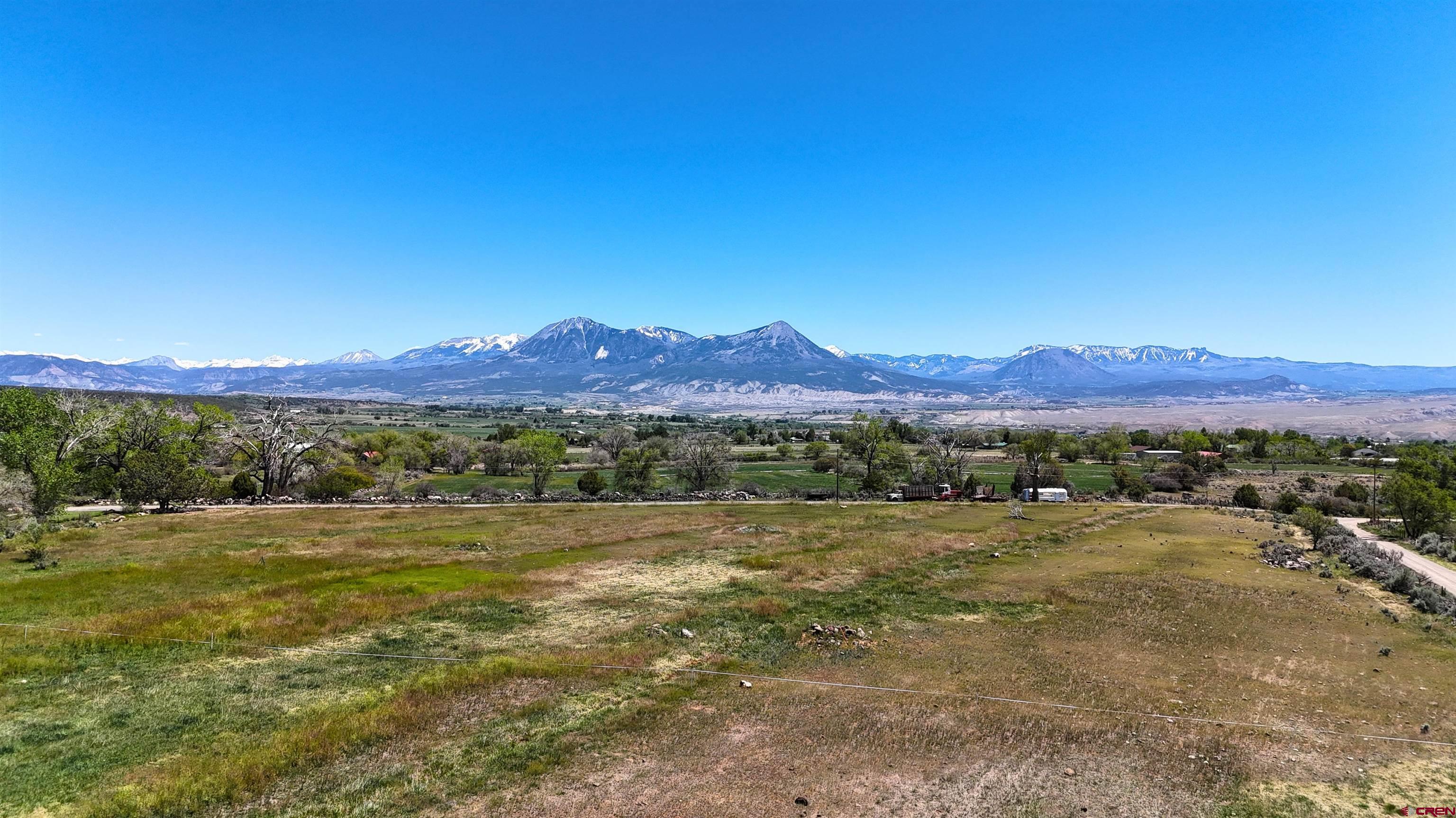 11306 3150th Road Hotchkiss, CO 81419 - Photo 4 of 13 a view of an outdoor space with mountain view