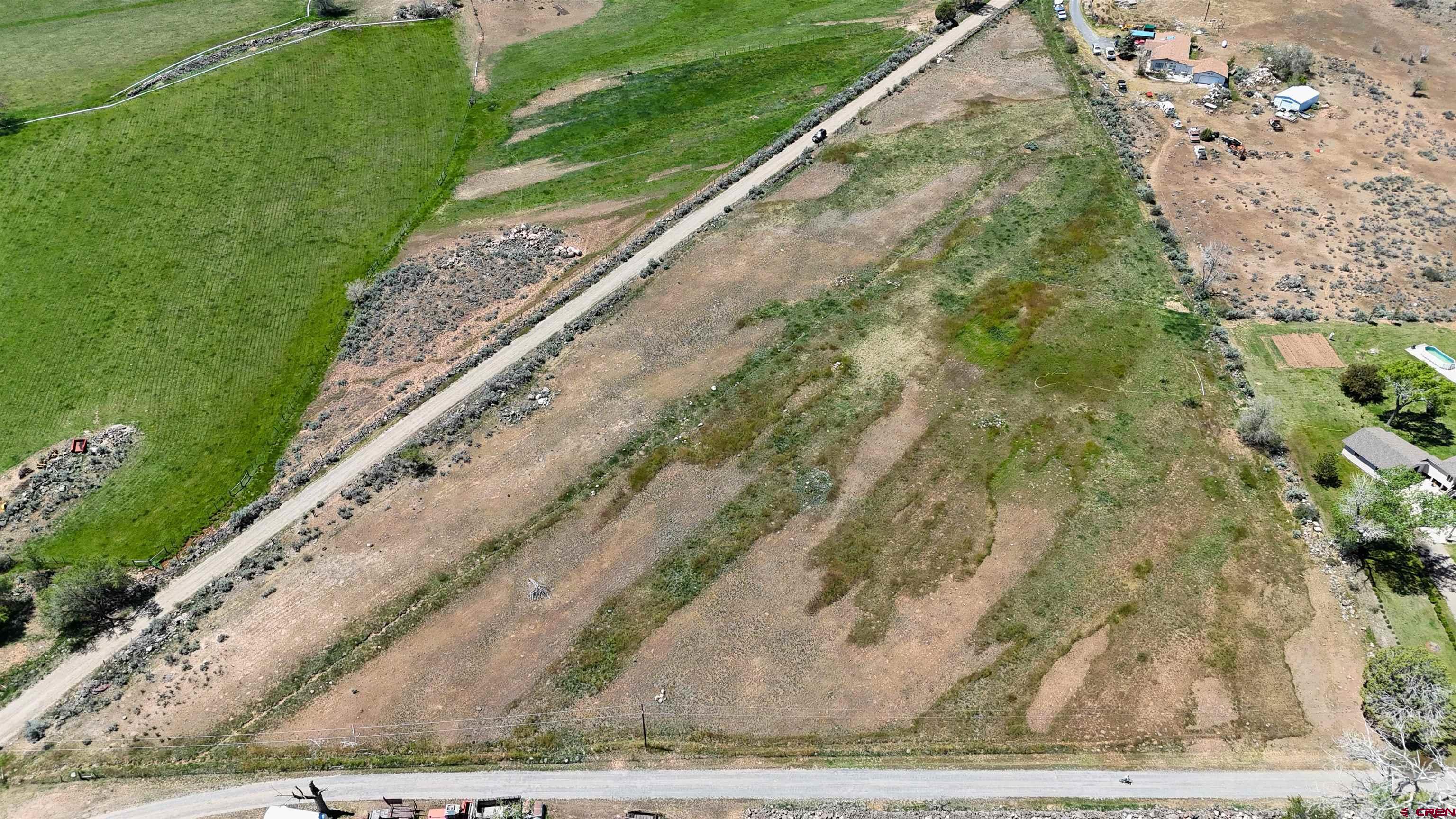11306 3150th Road Hotchkiss, CO 81419 - Photo 10 of 13 a view of a yard with an outdoor space