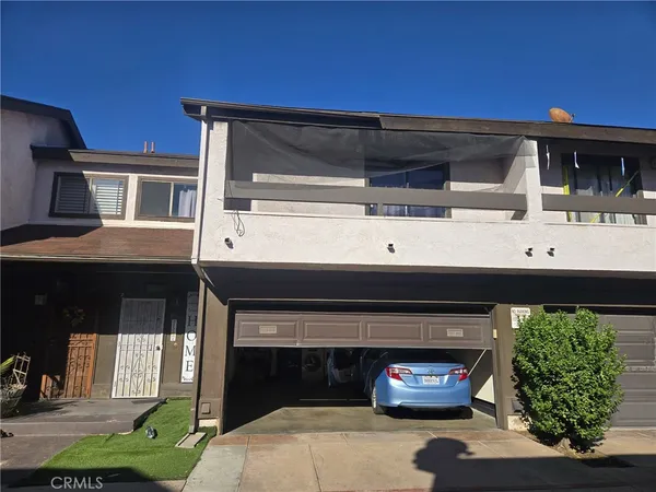 a view of outdoor space and front view of a house