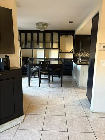 a lobby with furniture and a flat screen tv