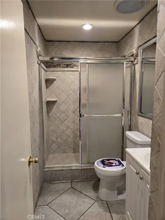 a bathroom with a toilet a shower and a sink