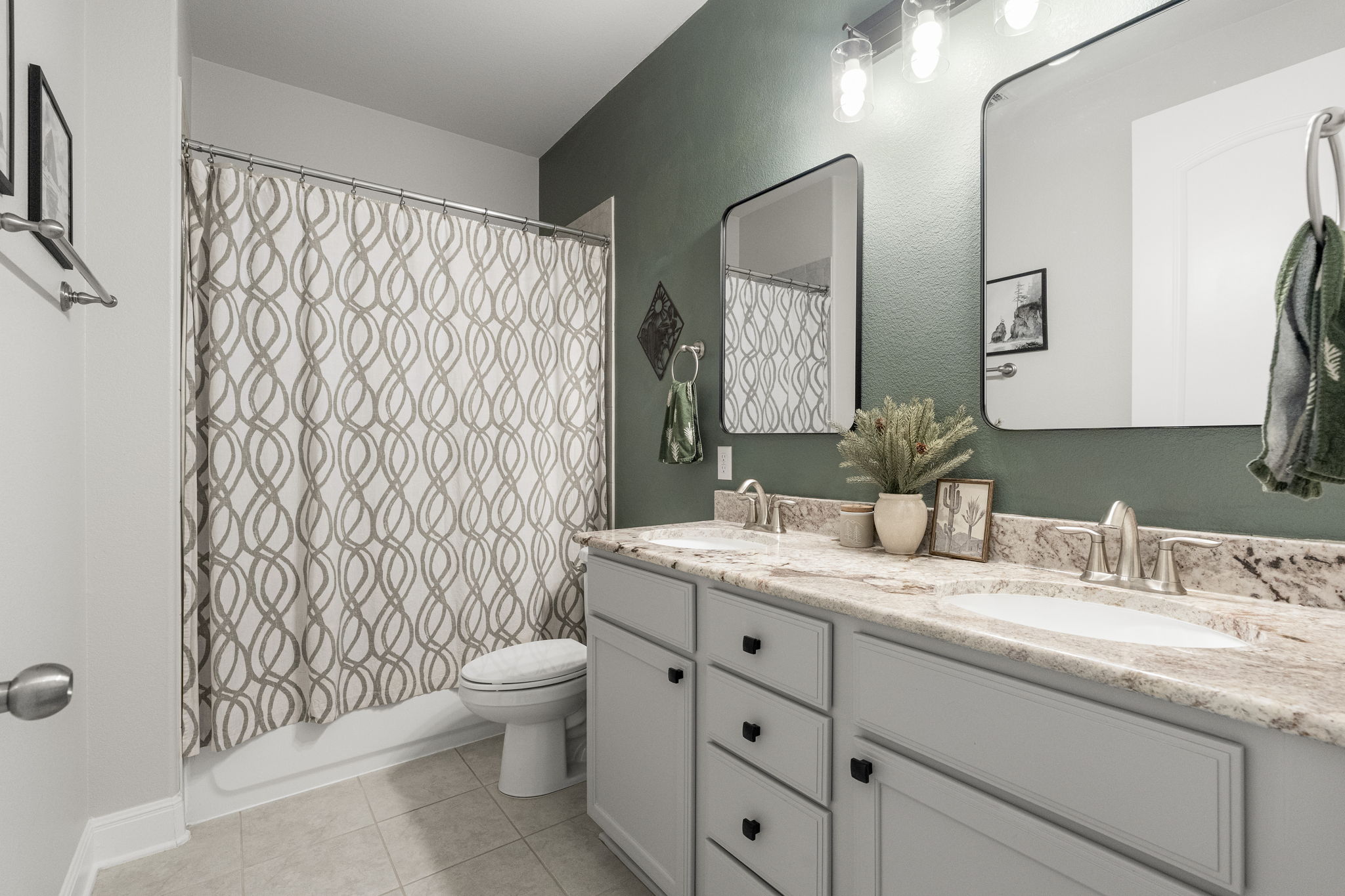 772 Founders Ridge Dripping Springs, TX 78620 - Photo 28 of 40 The secondary bathroom features generous counter space, dual vanities, and a functional layout designed for everyday convenience.