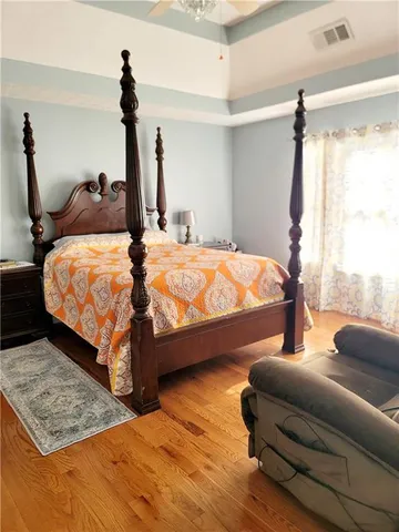 a bedroom with bed and window