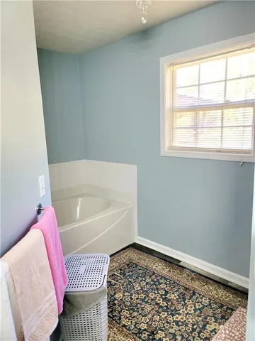 a bathroom with a bathtub and shower