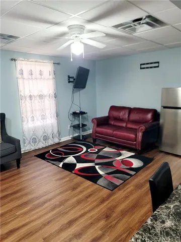 a bedroom with furniture and a window