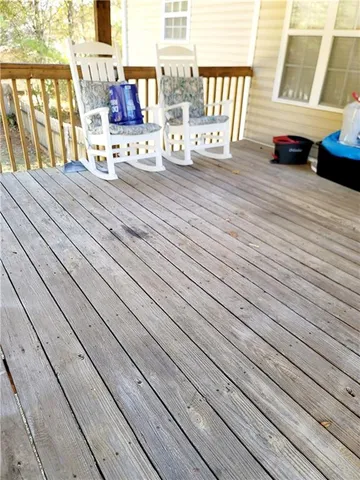 a view of deck with wooden floor and outdoor seating