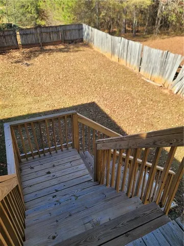 a view of a swimming pool with a yard