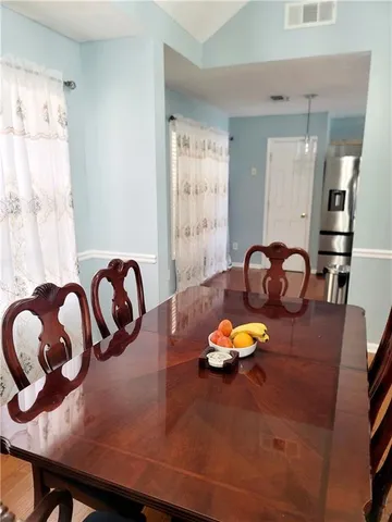 a view of a dining room with furniture
