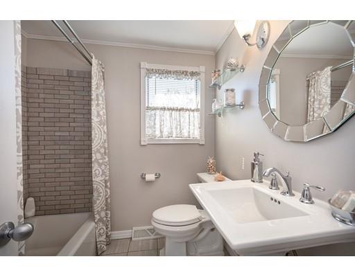159 Beach Avenue Hull, MA 02045 - Photo 13 of 28 a bathroom with a sink vanity mirror and toilet