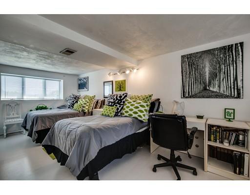 159 Beach Avenue Hull, MA 02045 - Photo 16 of 28 a bedroom with a bed table chair and a window