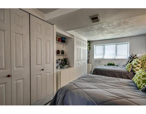 159 Beach Avenue Hull, MA 02045 - Photo 17 of 28 a bedroom with a bed and a window