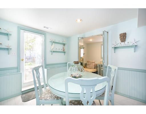 159 Beach Avenue Hull, MA 02045 - Photo 21 of 28 a view of a dining room with furniture and wooden floor