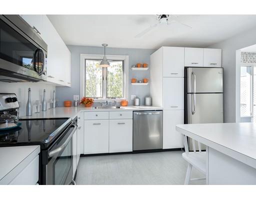 159 Beach Avenue Hull, MA 02045 - Photo 3 of 28 a kitchen with white cabinets and white appliances