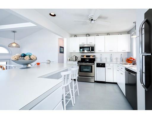 159 Beach Avenue Hull, MA 02045 - Photo 4 of 28 a kitchen with stainless steel appliances a stove sink refrigerator and cabinets