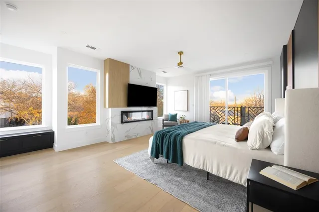 a bedroom with a bed and a flat screen tv