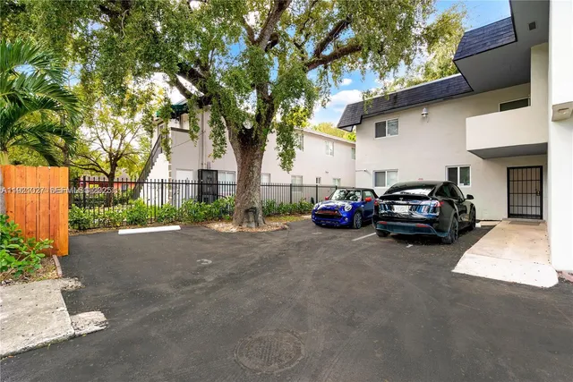 a view of a car parked in front of a house