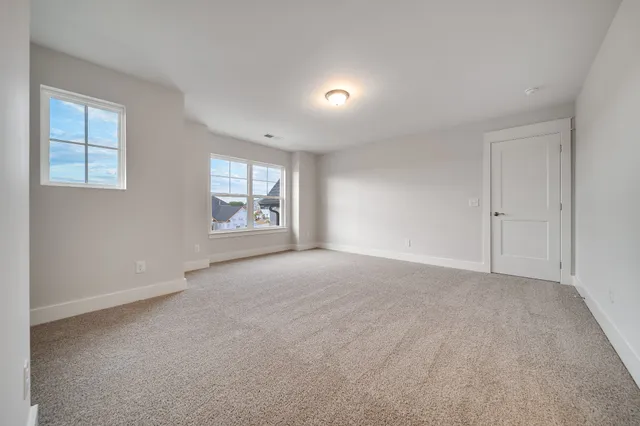 a view of kitchen with stainless steel appliances kitchen island granite countertop a refrigerator and a stove top oven