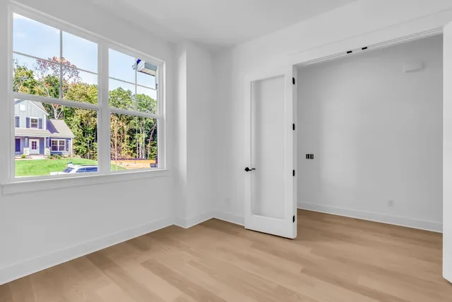 a kitchen with kitchen island granite countertop a sink center island and cabinets