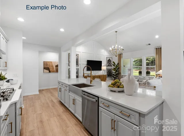 a kitchen with a sink and refrigerator