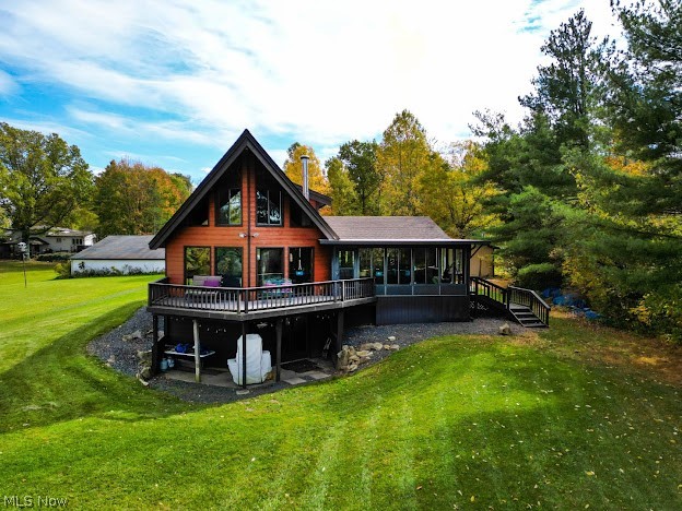 10176 Springfield Road Youngstown, OH 44514 - Photo 21 of 31 Rear view of property featuring a lawn and a deck