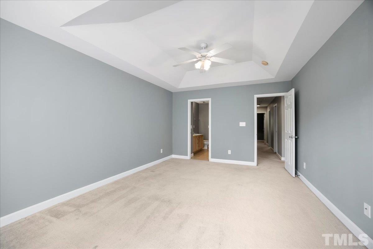 716 Saratoga Drive Durham, NC 27704 - Photo 14 of 30 a view of an empty room with a ceiling fan