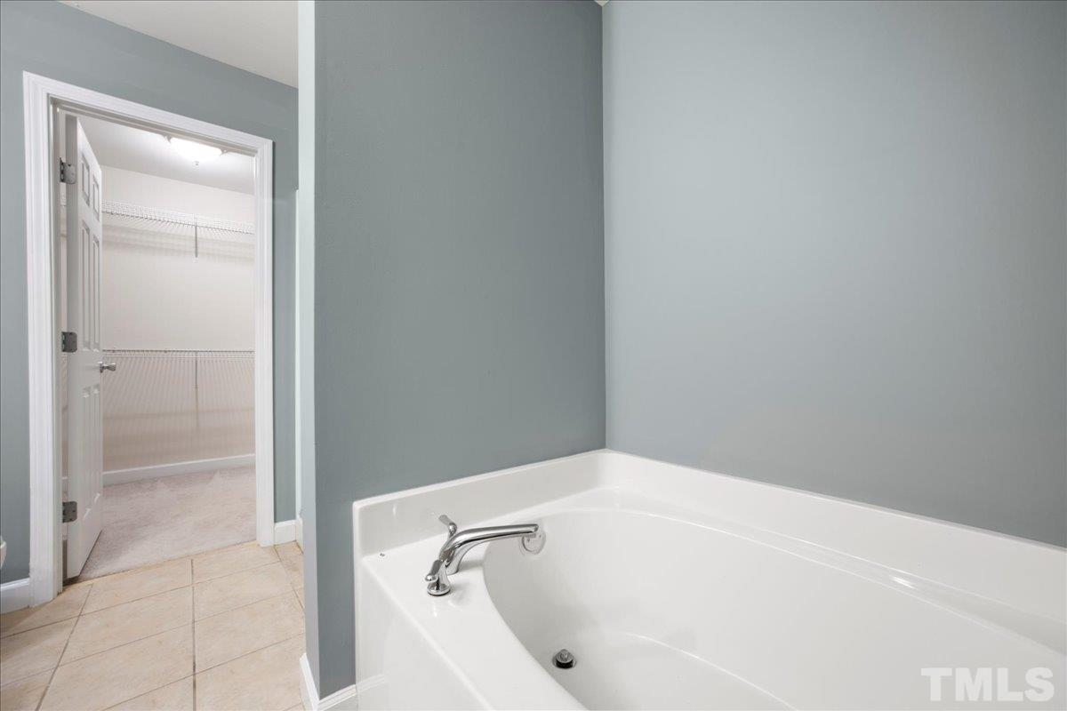 716 Saratoga Drive Durham, NC 27704 - Photo 16 of 30 a white bath tub sitting next to a shower