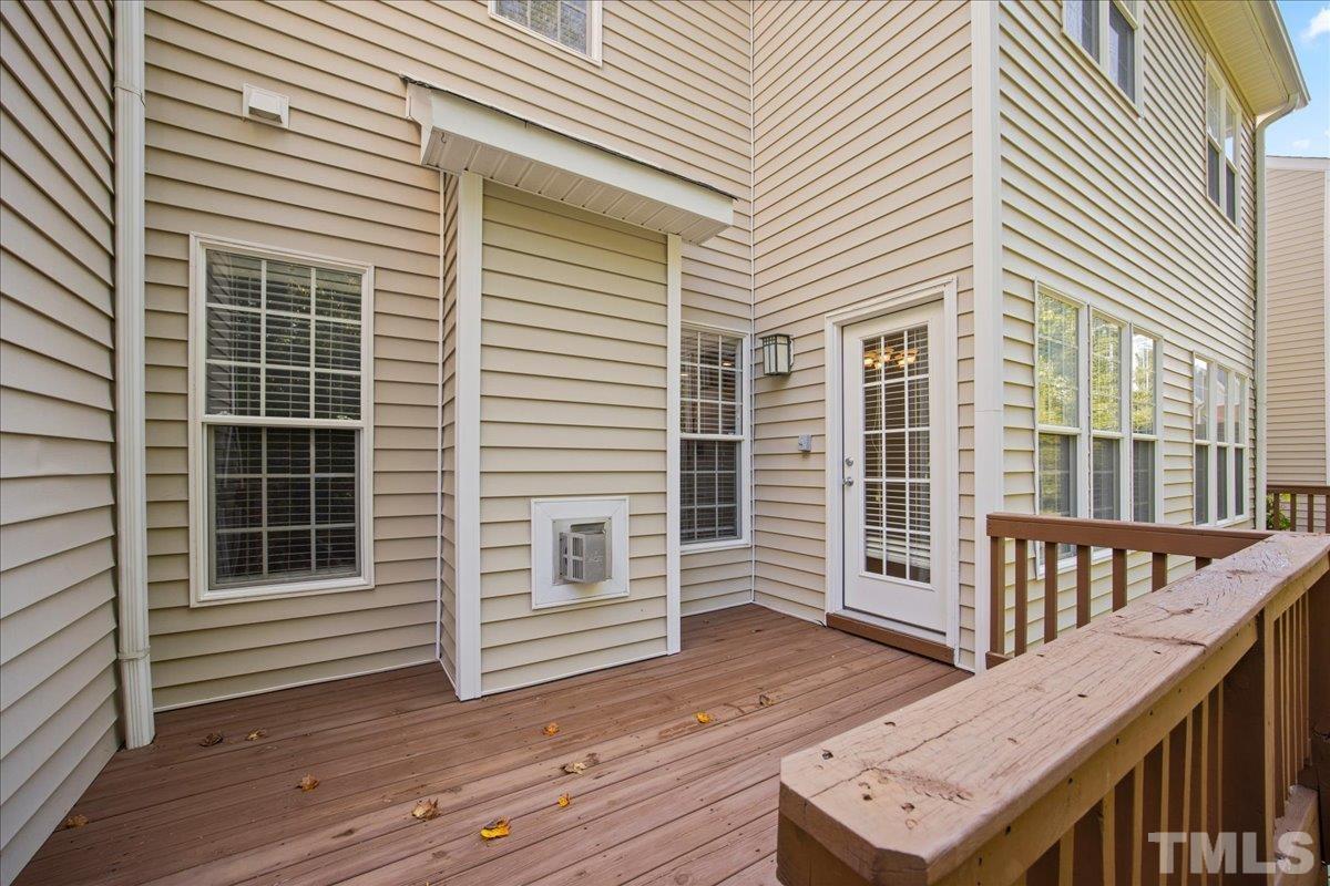 716 Saratoga Drive Durham, NC 27704 - Photo 27 of 30 a view of a deck with wooden floor and fence