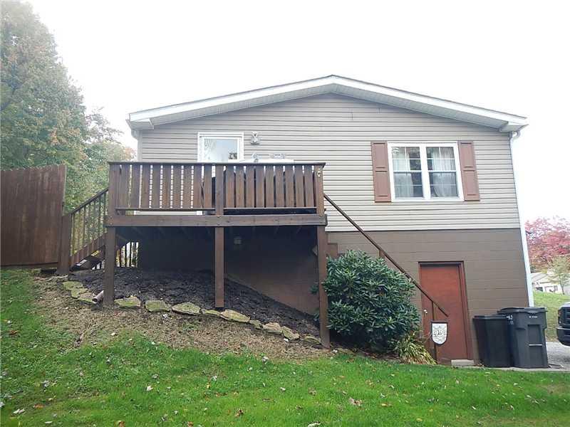 275 Boy Scout Road Evans City, PA 16033 - Photo 3 of 25 Exterior Front. This side of the home has another access to the fenced in rear yard, a deck, and a man door to the 2 car integral garage.