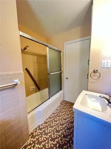 a bathroom with a sink and mirror