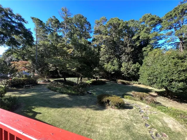 a view of a lake with a yard