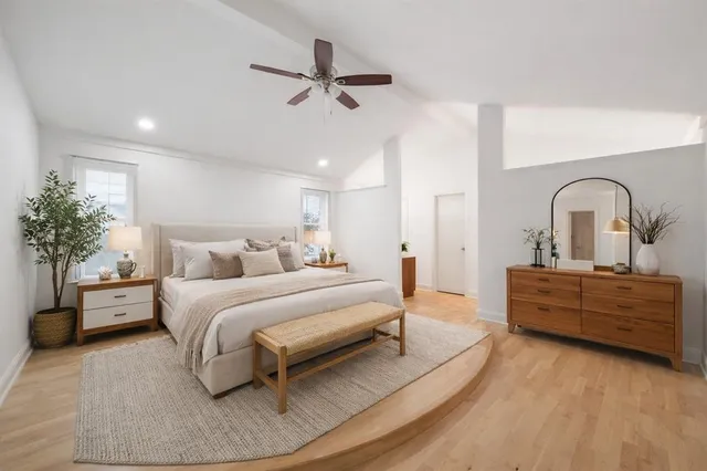 a bed room with bed and window