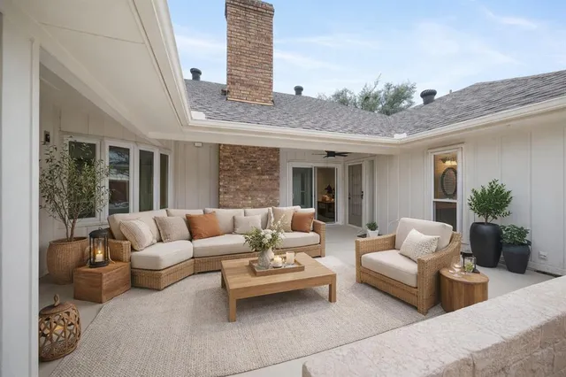 a balcony with furniture and outdoor view