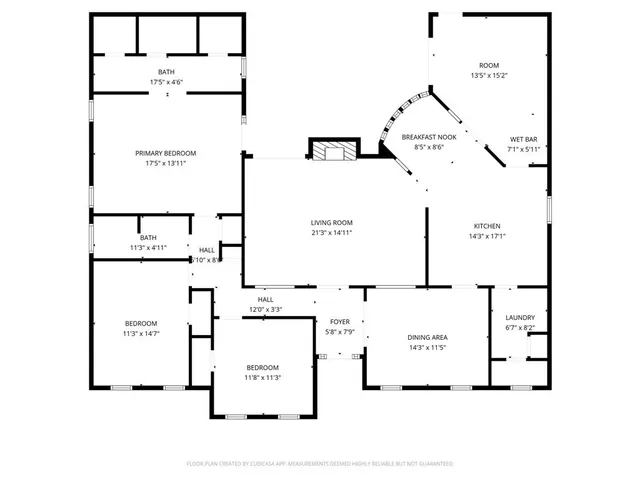 a front view of a house with a yard and outdoor seating