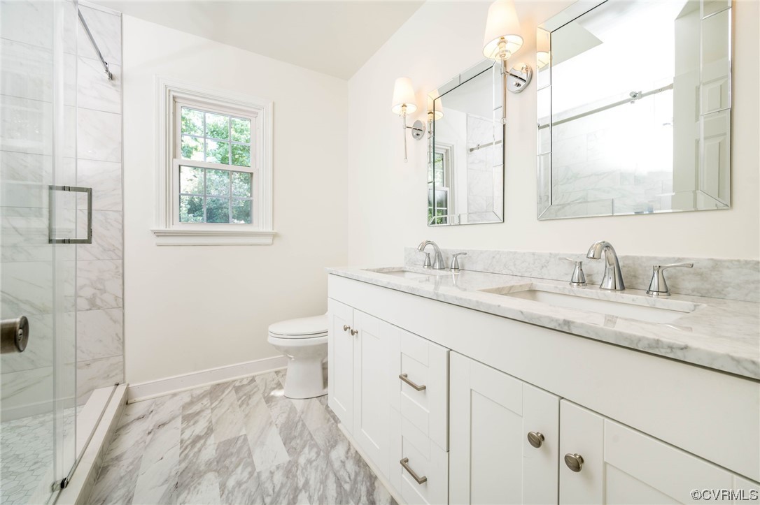 5801 Gates Mill Court Midlothian, VA 23112 - Photo 24 of 42 a bathroom with a granite countertop sink a toilet and a window