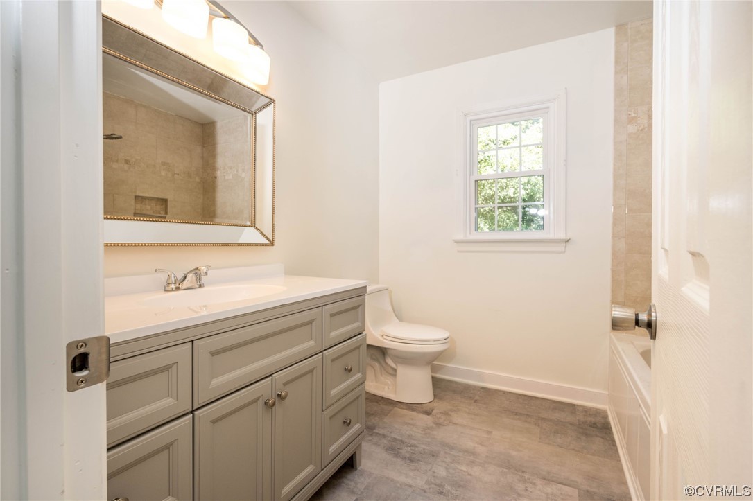 5801 Gates Mill Court Midlothian, VA 23112 - Photo 31 of 42 a bathroom with a granite countertop sink toilet and mirror