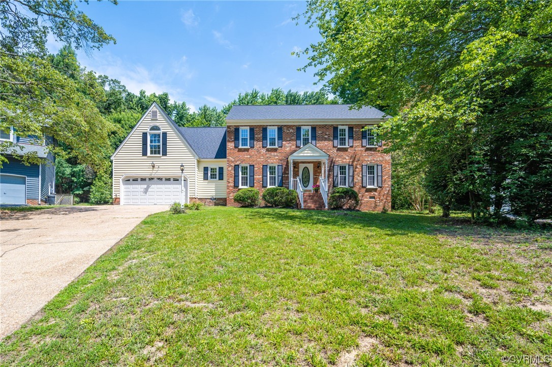 5801 Gates Mill Court Midlothian, VA 23112 - Photo 41 of 42 a front view of a house with a garden