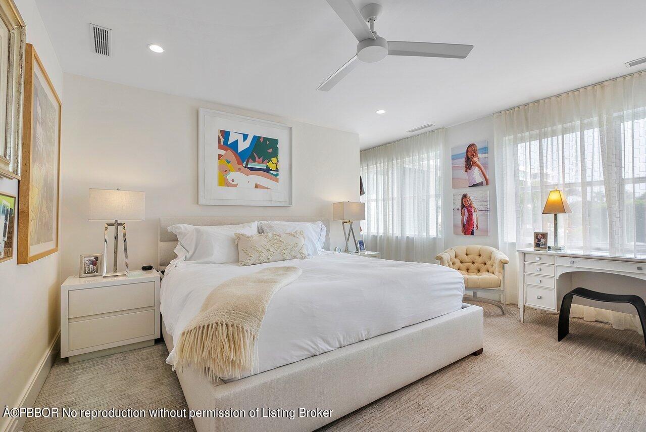 44 Cocoanut Row, Unit 122B Palm Beach, FL 33480 - Photo 11 of 21 a bedroom with a bed and a couch