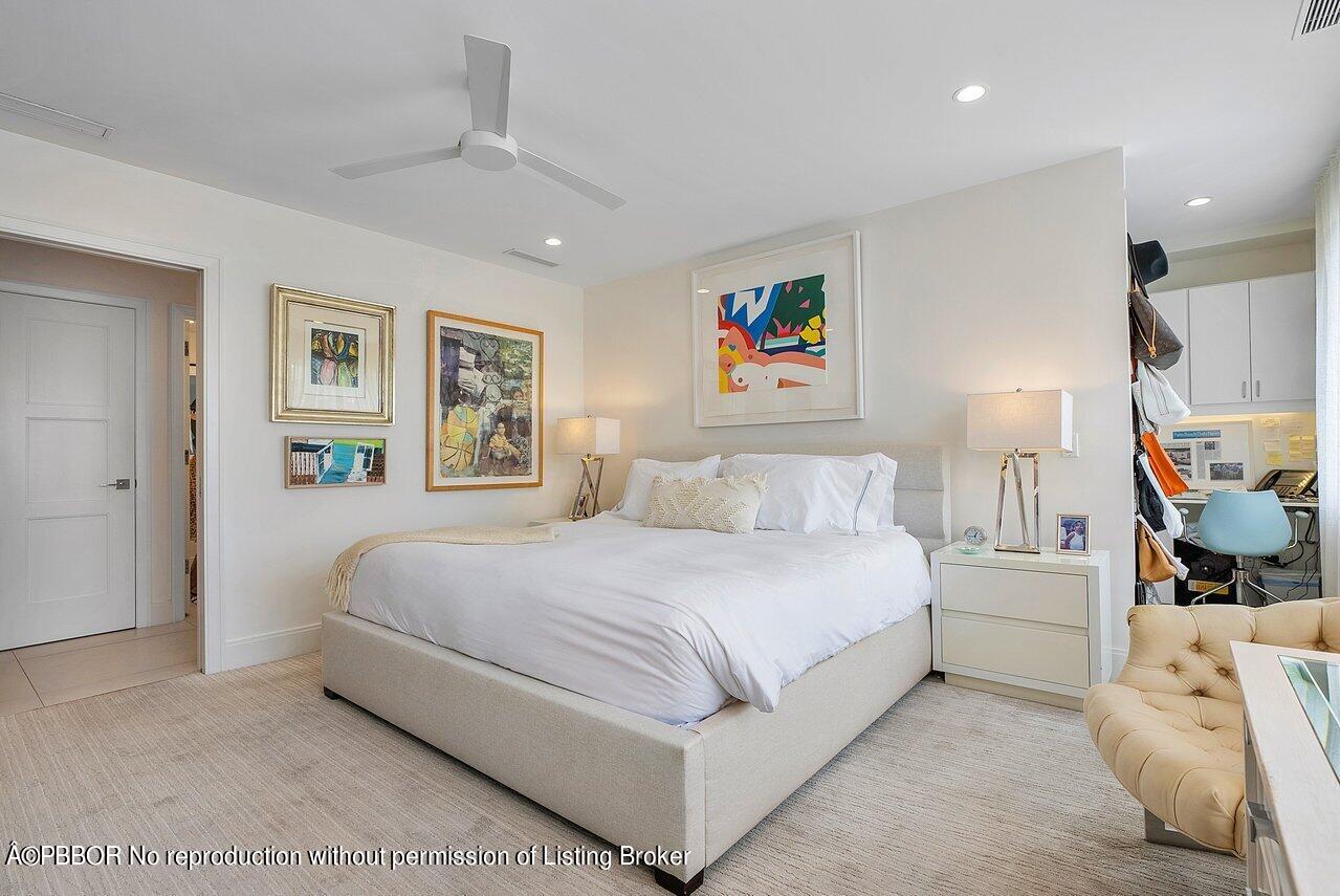 44 Cocoanut Row, Unit 122B Palm Beach, FL 33480 - Photo 12 of 21 a bedroom with a large bed and a couch