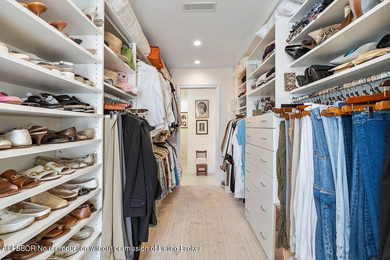 44 Cocoanut Row, Unit 122B Palm Beach, FL 33480 - Photo 17 of 21 a view of walk in closet with clothes and shoes
