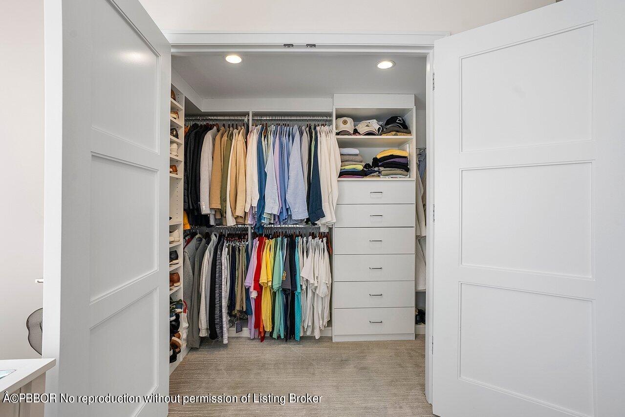 44 Cocoanut Row, Unit 122B Palm Beach, FL 33480 - Photo 18 of 21 a view of walk in closet with clothes