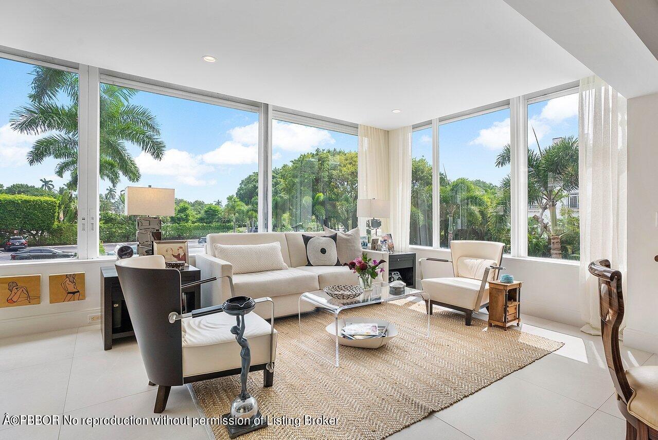 44 Cocoanut Row, Unit 122B Palm Beach, FL 33480 - Photo 3 of 21 a living room with furniture and a large window
