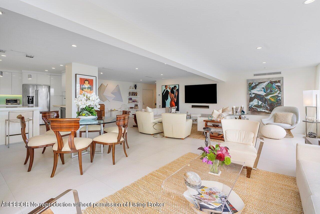 44 Cocoanut Row, Unit 122B Palm Beach, FL 33480 - Photo 9 of 21 a living room with furniture and a flat screen tv